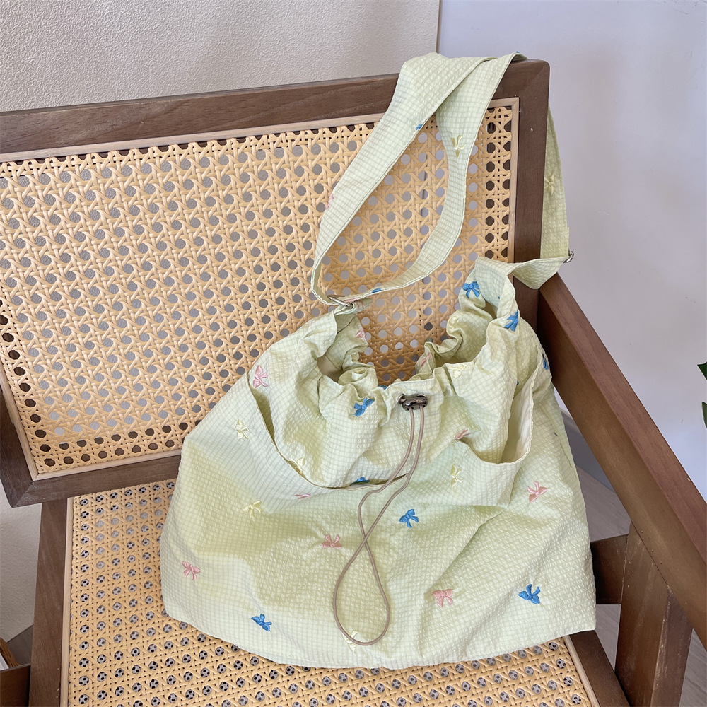 53201 Spring/Summer New style fresh and versatile embroidered bow single-shoulder bag, checkered underarm bag, laid-back canvas bag Application Scenario