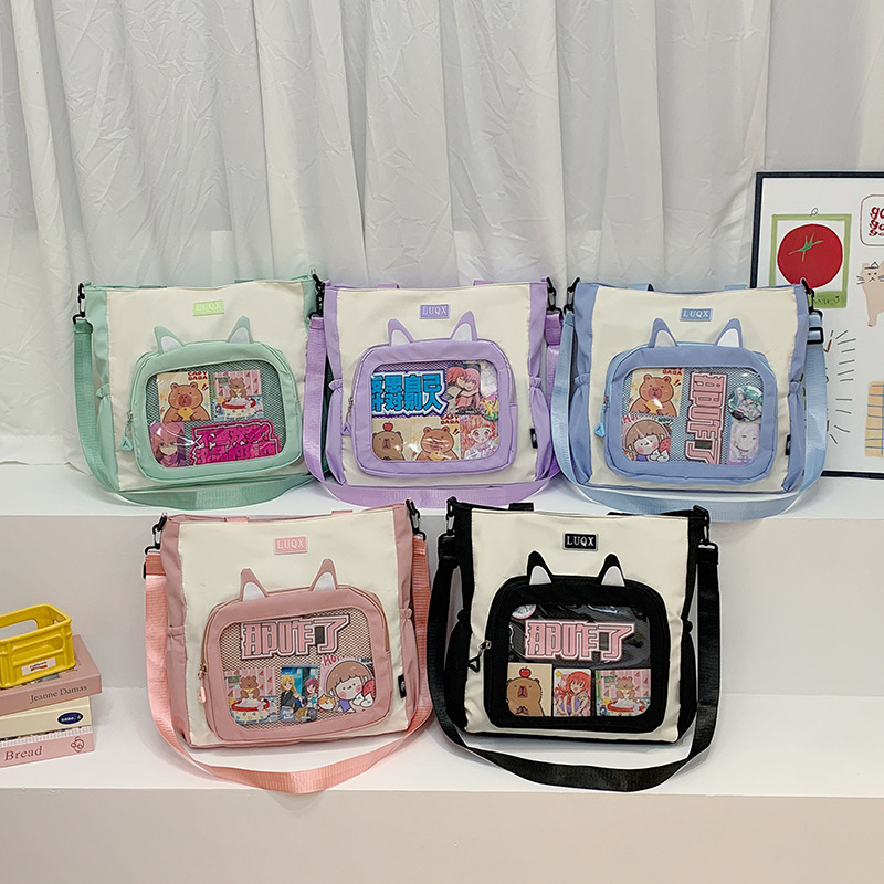 The new cute cartoon printed student bag with a large capacity and transparent student storage single-shoulder bag is selling well for women full figure