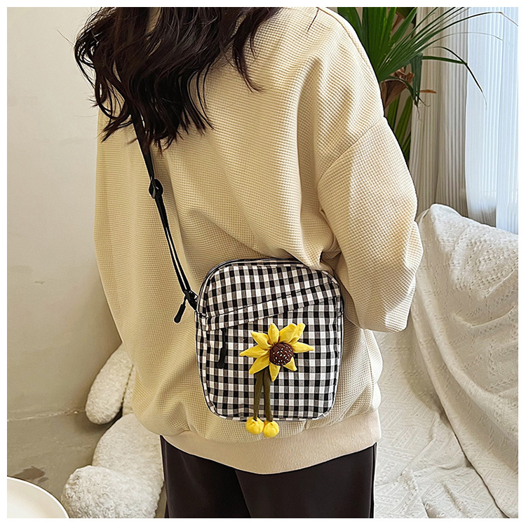 The 2024 new checkered style women's bag is a fashionable and simple small crossbody bag. It features a stylish floral single-shoulder square bag and a crossbody bag full figure