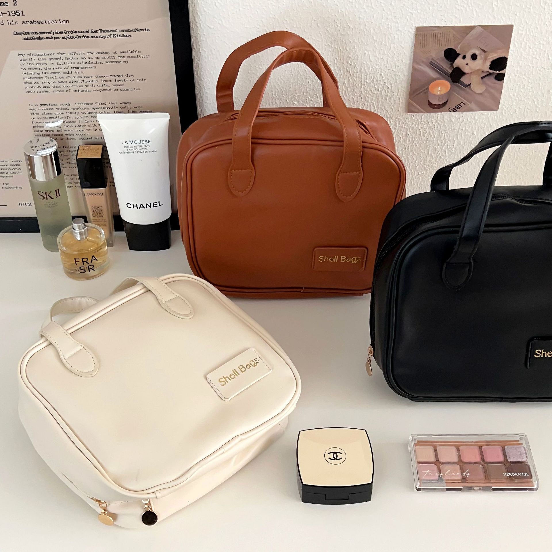 A high-end portable hand-held cosmetics storage bag with large capacity for women in 2024, and a travel toiletries bag with compartments full figure