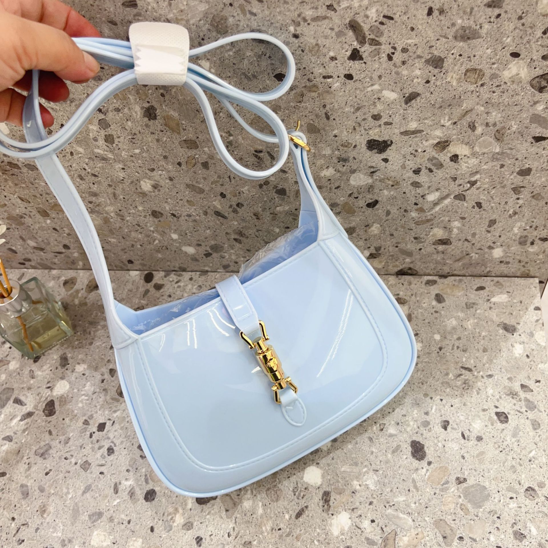 2025 New PVC single-shoulder women's small bag, candy-colored hand-carry crossbody trendy and fashionable casual lock bag Application Scenario