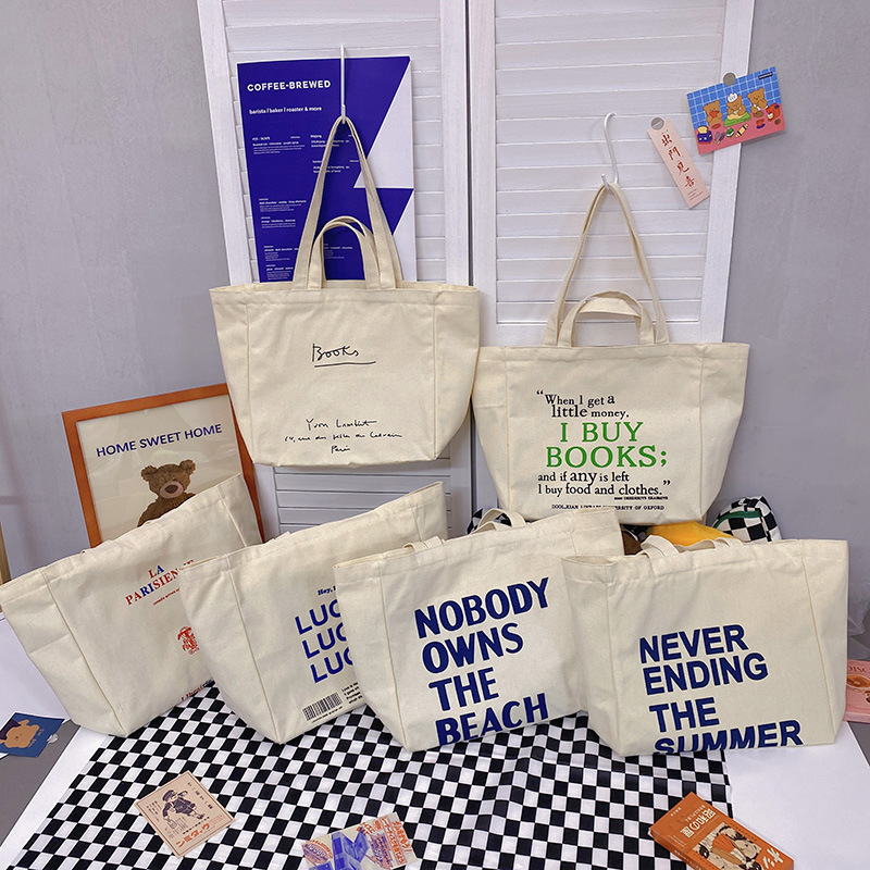 A large-capacity, sturdy Japanese-style canvas bag for women, a new 2022 simple bento handbag for girls to go to work full figure