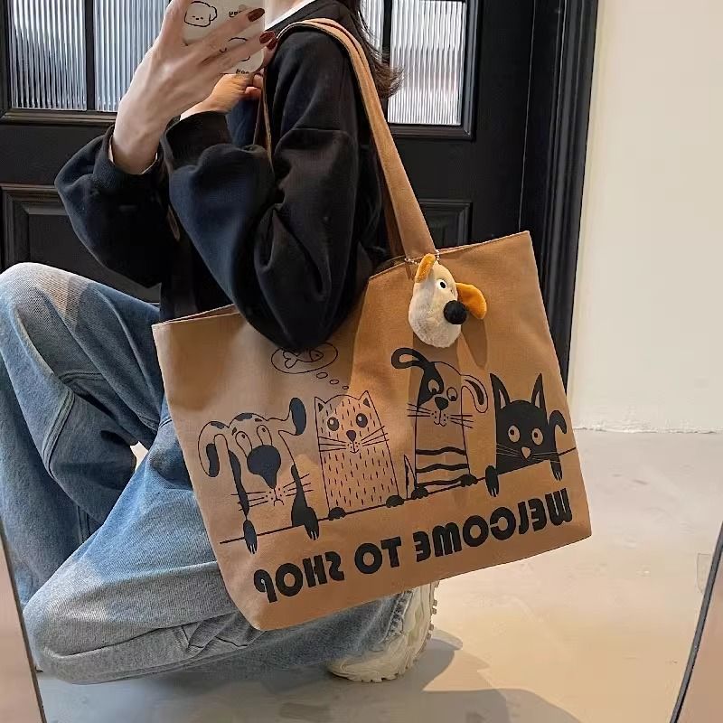 New canvas bag for women 2025, large capacity student shoulder bag, versatile cartoon tote handbag, tote commuter bag Application Scenario
