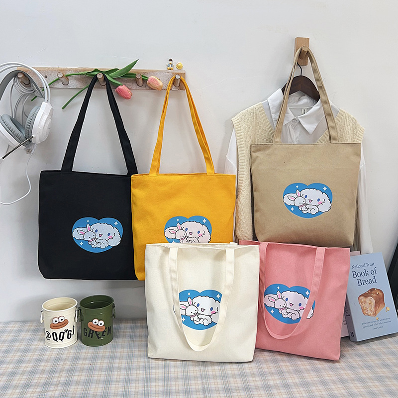 New Japanese-style canvas bags for women, cartoon-printed single-shoulder bags, large capacity, versatile hand-held tote bags for women Application Scenario