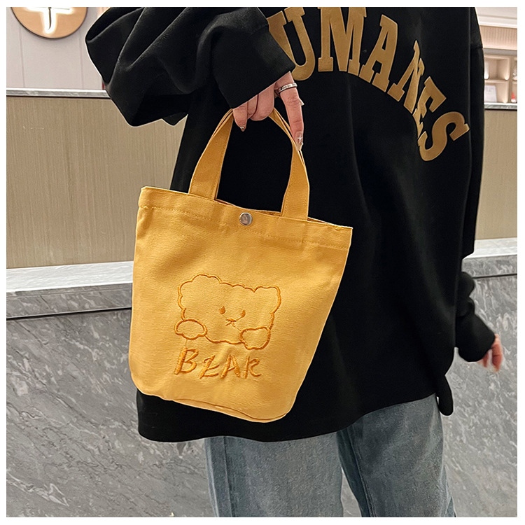 Personalized ladies' bucket bag, versatile and cute canvas bear wholesale, simple Japanese style new handbag full figure