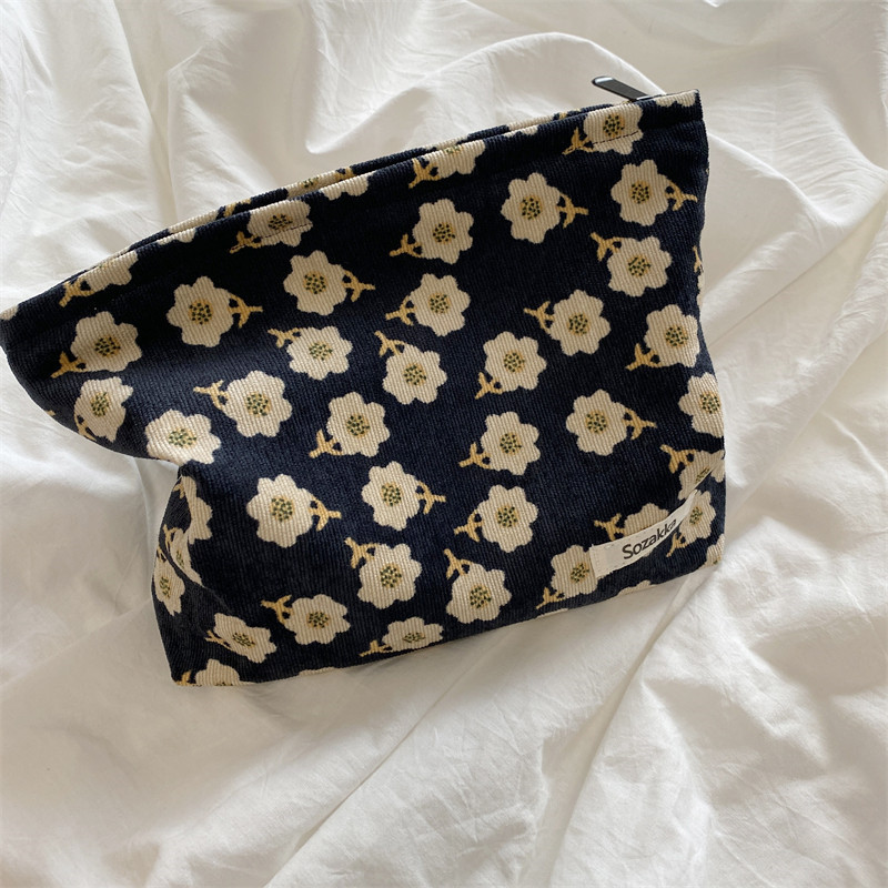 110223 Corduroy plum blossom cosmetic bag, carry it with you, hold the coin purse, women's ins Japanese-style artistic storage bag Application Scenario