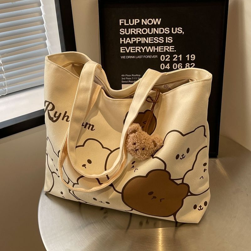 A new large-capacity casual bag for women, a cartoon bear canvas bag, and a single-shoulder tote bag for college students' commuting to class full figure