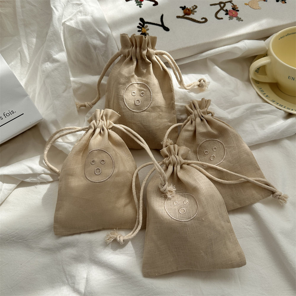 44122 Storage bag, linen embroidered smiling face, portable dust-proof bag for miscellaneous items, small drawstring drawstring pocket full figure