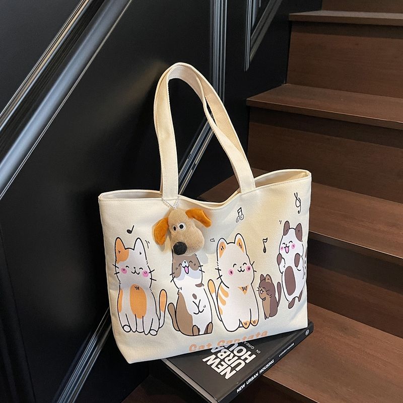 The new spring 2025 Korean-style laid-back large-capacity canvas bag for women, single-shoulder student, artistic and simple tote bag trend full figure