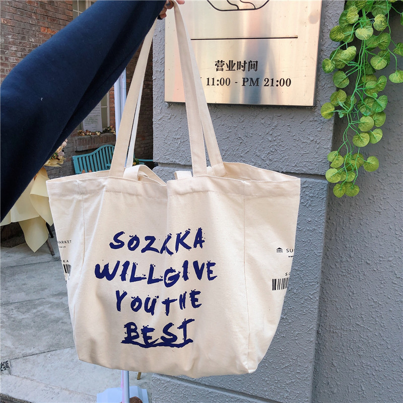 Wholesale of 91121 ins canvas bags, crossbody single-shoulder bags, large-capacity hand-held cloth bags for Japanese female students Item Picture