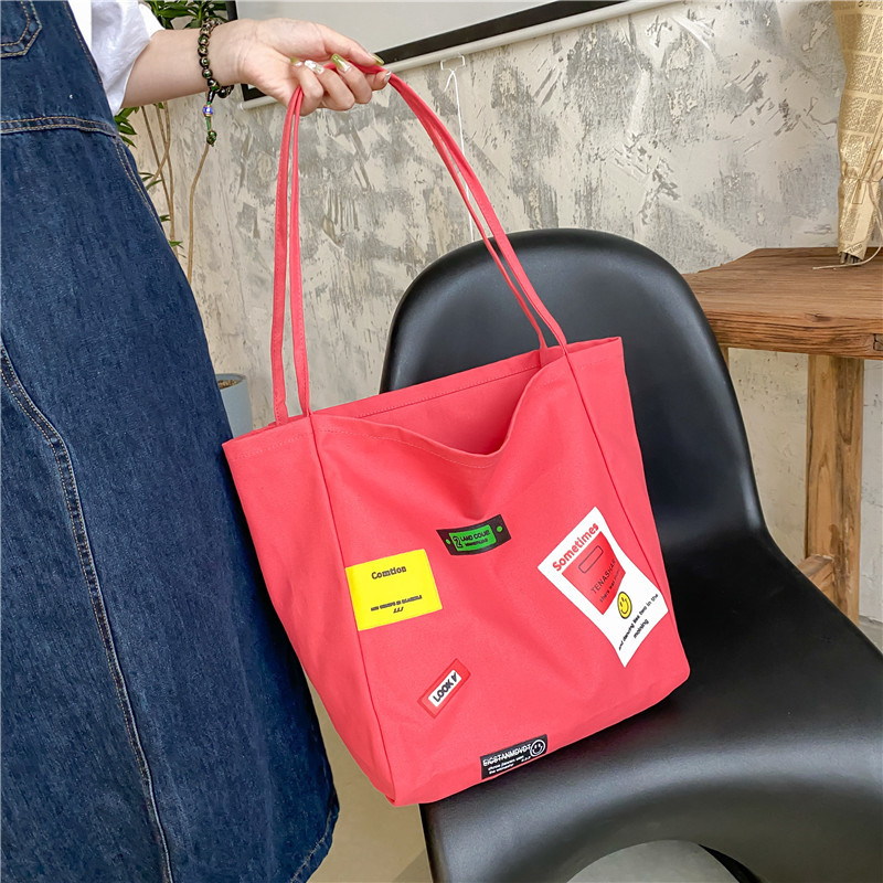 Korean style ins letter-printed open-top thin shoulder strap large-capacity canvas bag, simple and casual single-shoulder bag and schoolbag for women Application Scenario