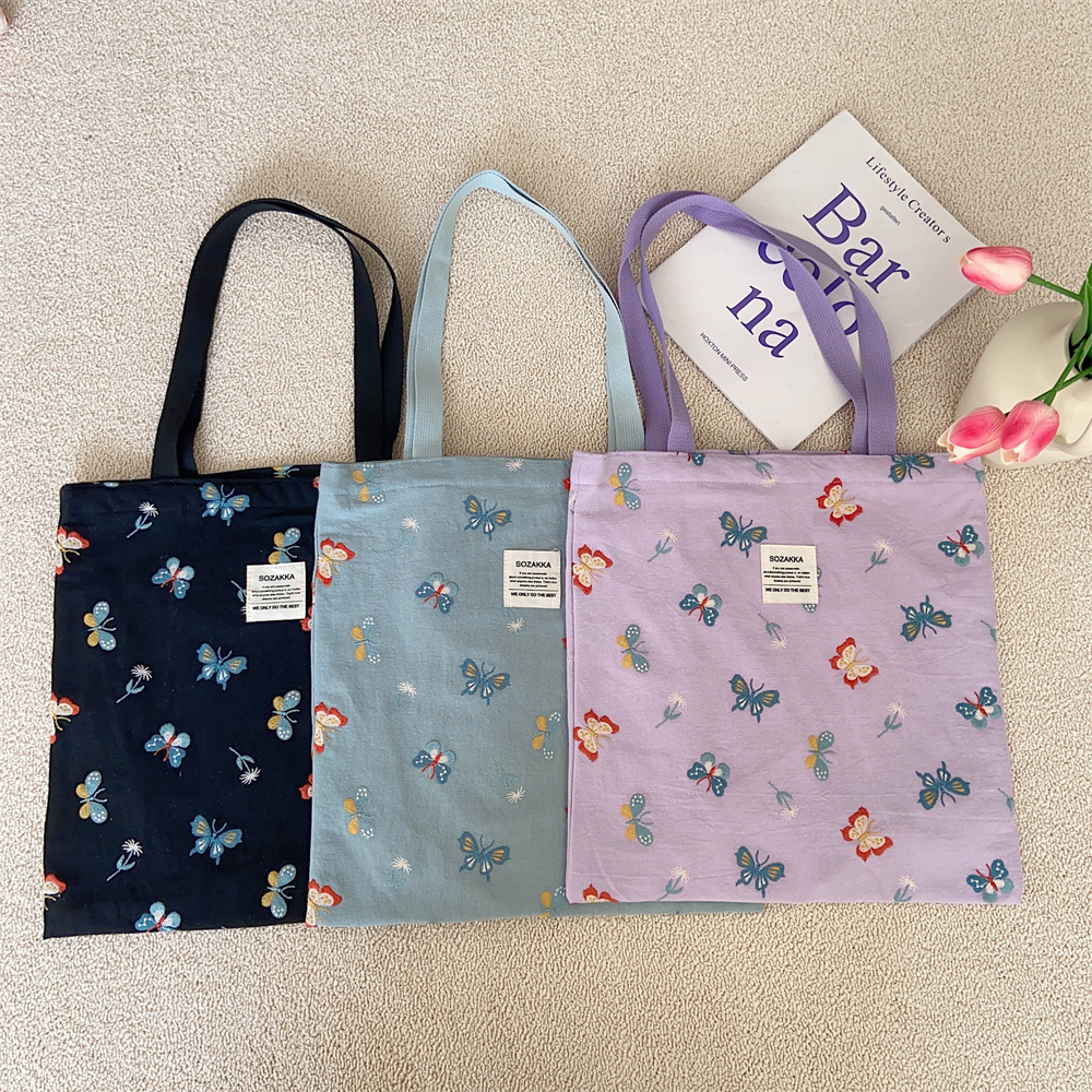 43204 Gentle sky blue embroidered butterfly canvas bag tote bag, single-shoulder handbag, casual shopping cloth bag Application Scenario