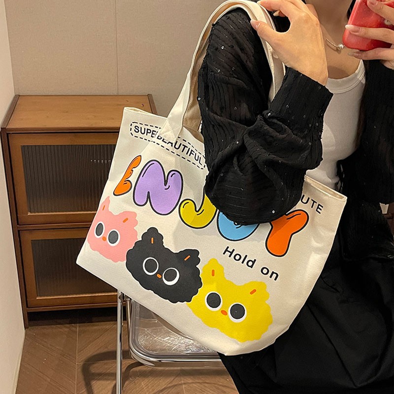 2024 New canvas bag for women, a cute and charming commuter bag for women, a canvas bag, a simple handbag, a large-capacity tote bag details Picture