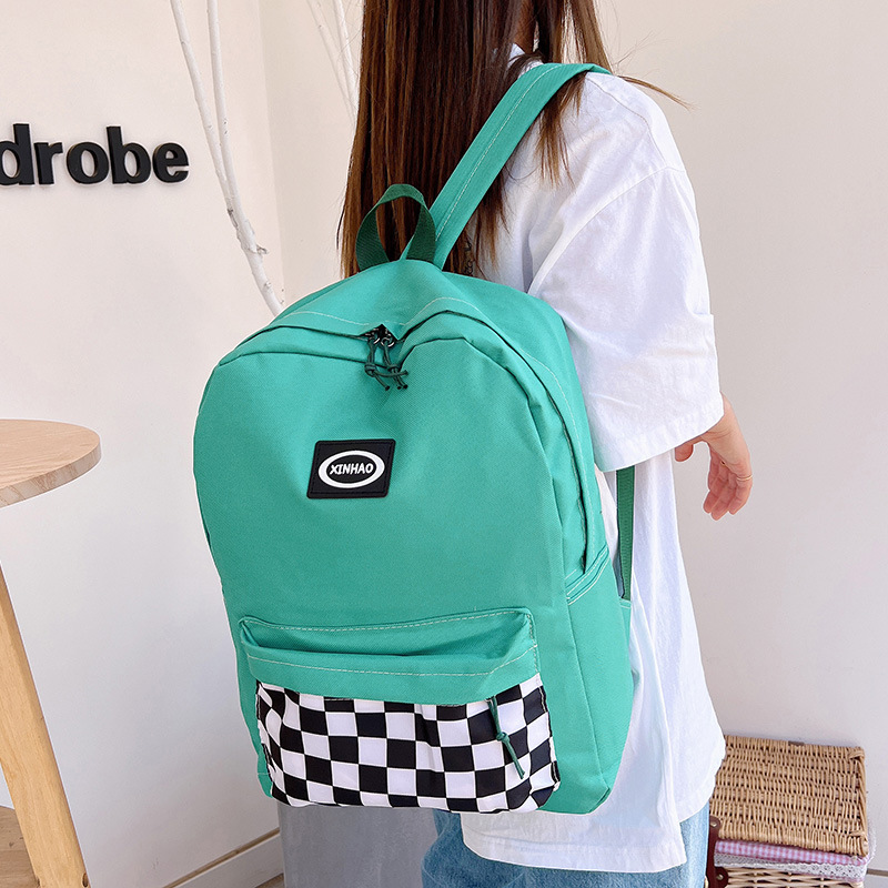 New checkered backpack for female college students, high school and junior high school students, large-capacity backpack, Korean version checkered simple backpack Application Scenario