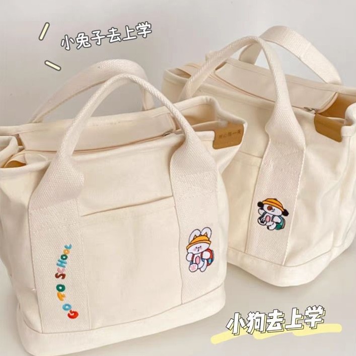 A cute Japanese-style canvas bag with dog letters, a new style for women, a handbag for moms going out, a bento bag, and a handbag for office workers Specification drawing