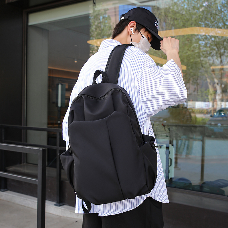 High-end custom large-capacity cross-border wear-resistant bag, solid-color bag for junior high school, senior high school and college students, men's and women's bags, versatile backpacks Application Scenario