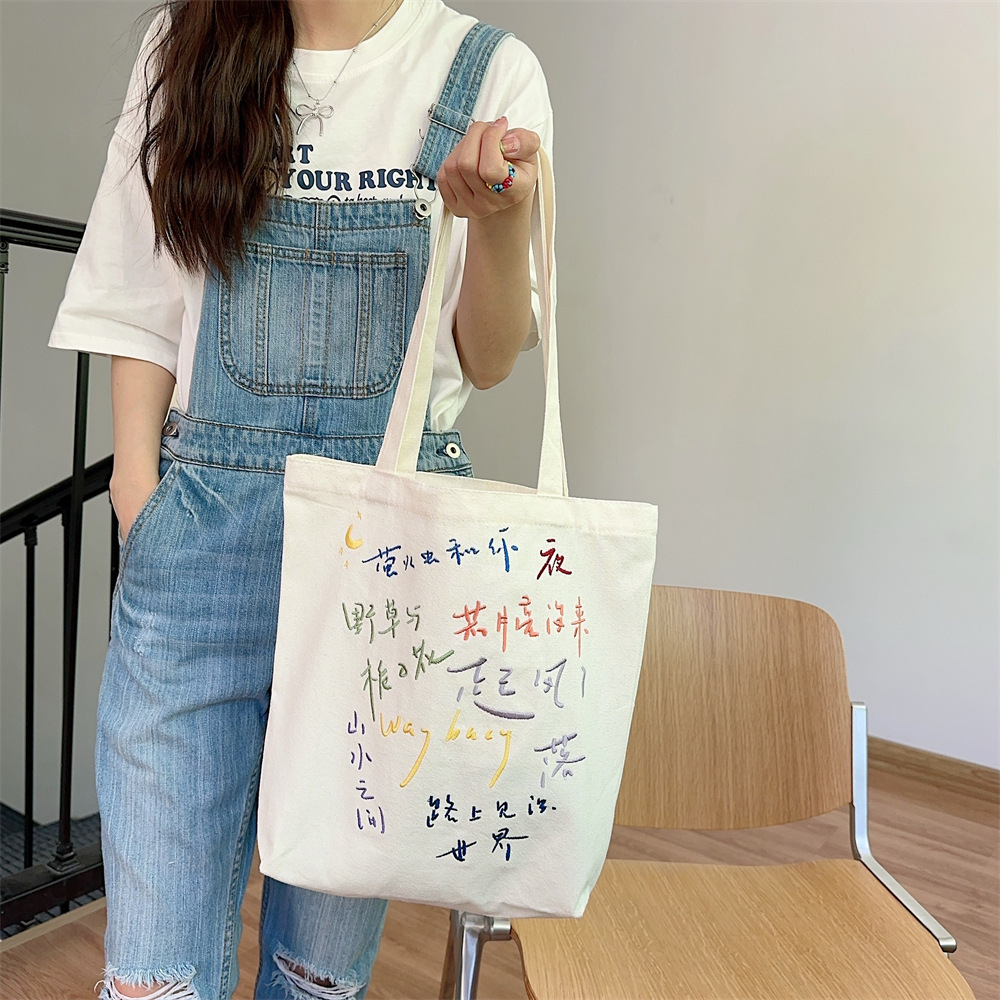 44302 Canvas single-shoulder bag for girls, large-capacity simple embroidered vest bag, hand-held schoolbag for students, canvas bag Application Scenario
