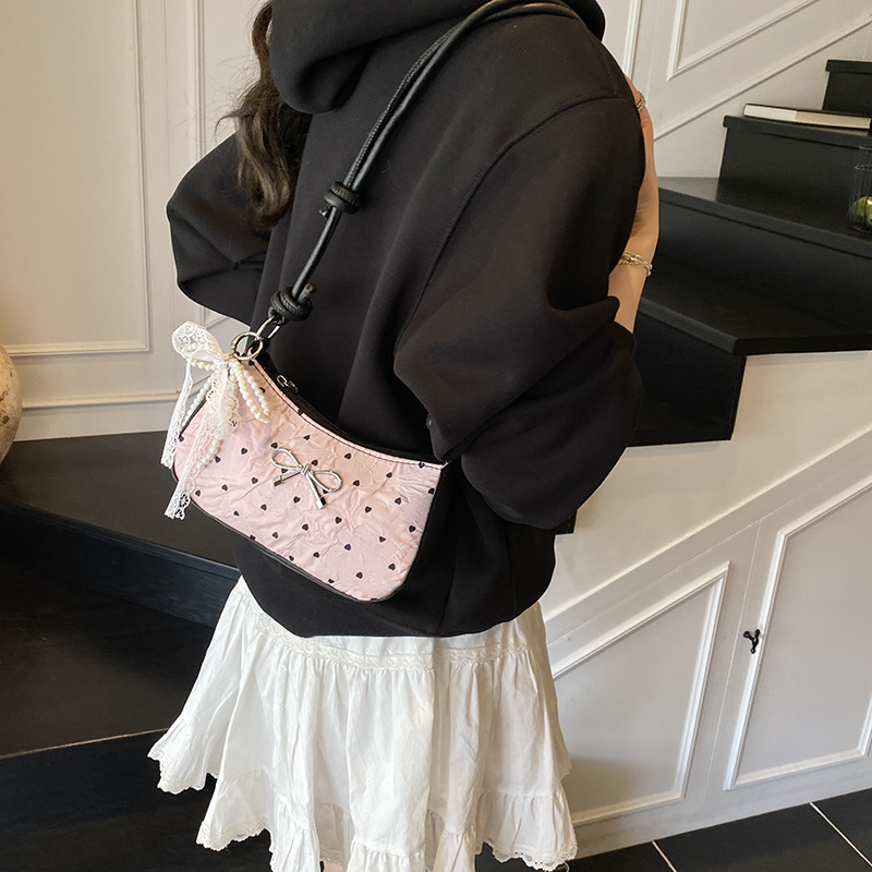 This high-end and light luxury single-shoulder bag is a new summer style. It features a cute pink bow-shaped small square bag and is versatile. It is a crescent-shaped underarm bag for women details Picture