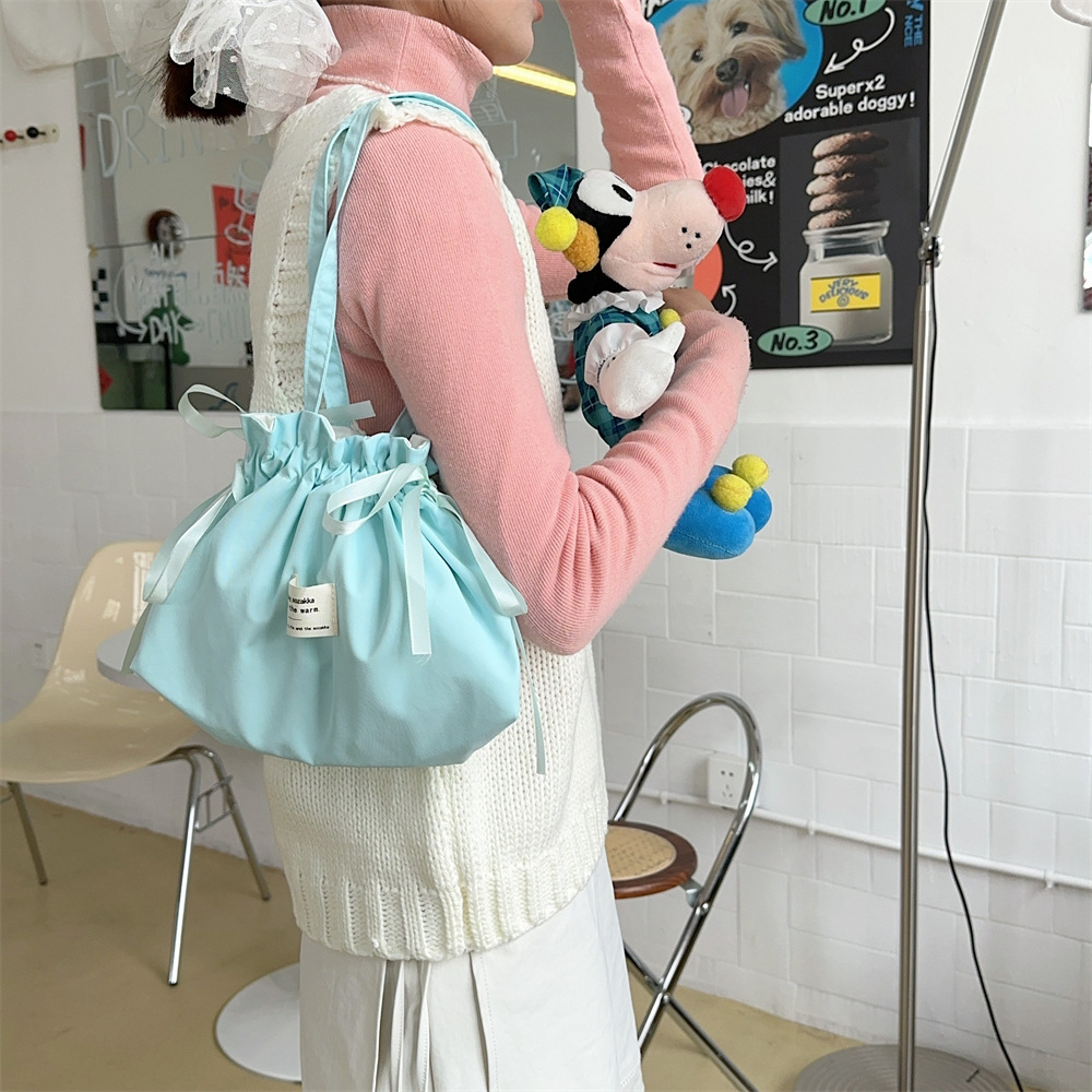 52222 Mint green handbag, small and exquisite small cloth bag, solid color simple drawstring bag, student portable single-shoulder bag Application Scenario