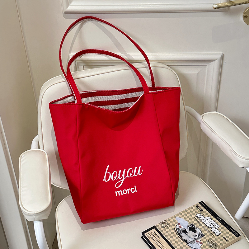 The new 2025 Korean version of the ins tote casual bag with striped canvas and a large-capacity single-shoulder tote bag are now on sale details Picture