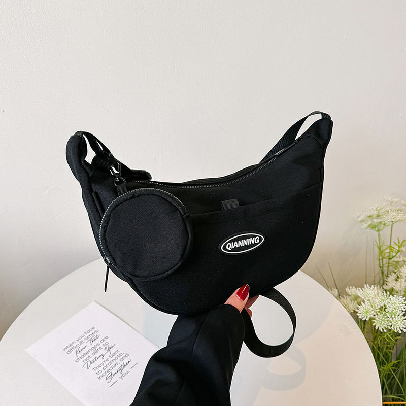 The 2024 new high-quality single-shoulder crossbody canvas bag for women, a popular and niche design dumpling bag for women details Picture