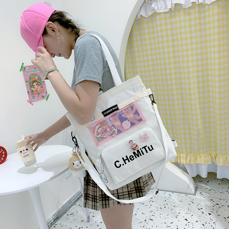 Korean-style canvas bag for girls with one shoulder, in the style of Harajuku, ulzzang, with a large capacity and contrasting colors, is a crossbody hand-held schoolbag for classes Application Scenario