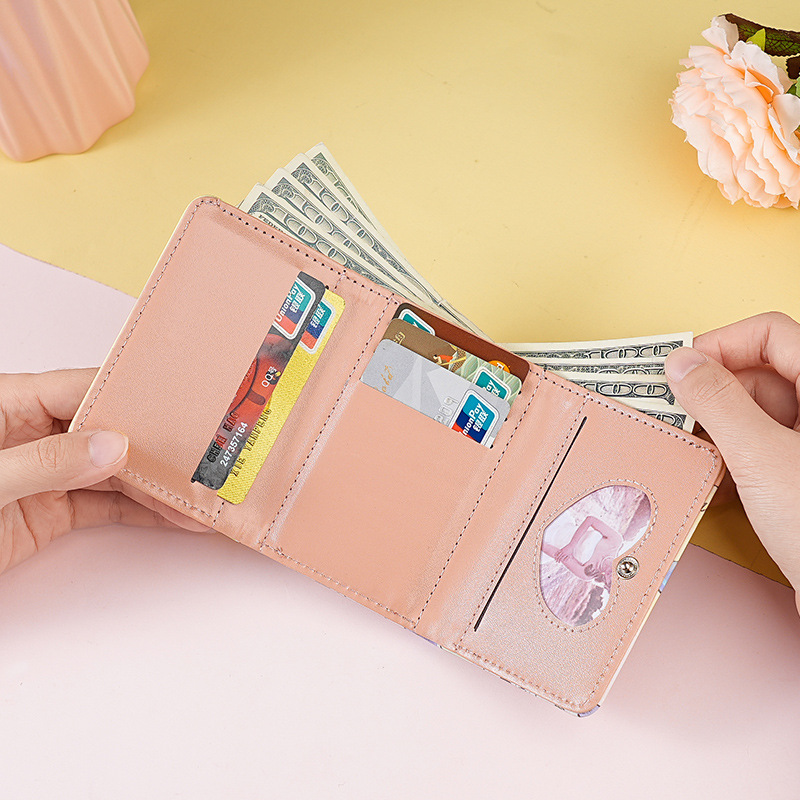 This is a new minimalist, colorful graffiti short, cute and niche design for women. It features a foldable, compact and multi-slot three-fold wallet details Picture