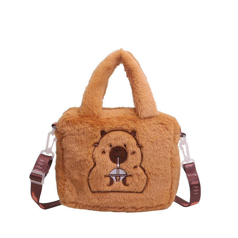 A fashionable and simple crossbody bag is selling well. It's a new hand-held cosmetic doll bag, a children's claw machine doll, and a crossbody pocket with loose change Item Picture