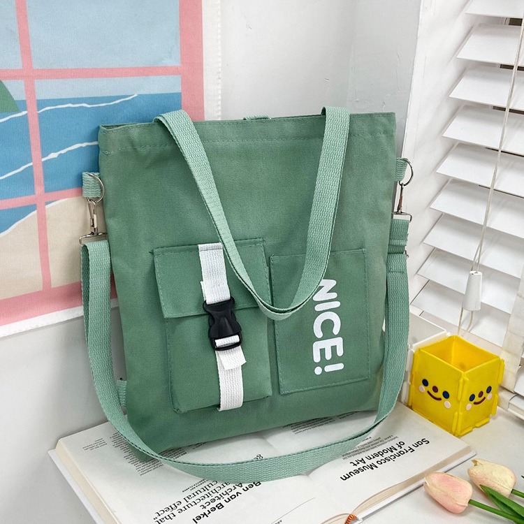 A large-capacity crossbody bag for spring 2024, featuring Japanese and Korean printed canvas for women and a student single-shoulder canvas bag with logo printing Specification drawing