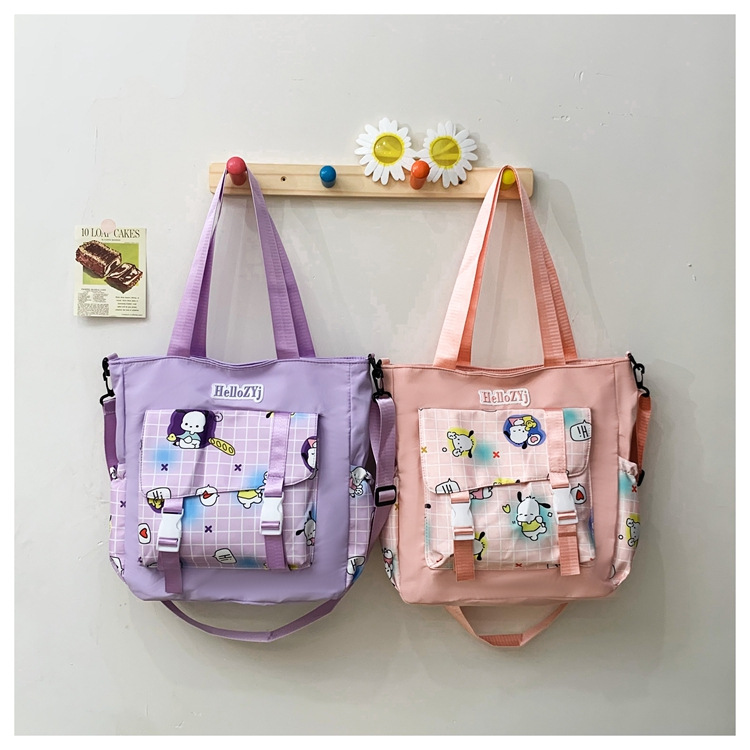 A new Korean-style student crossbody bag with high appearance standards, a fresh and casual single-shoulder bag, and a cartoonish and cute hand-held tutorial bag for girls details Picture