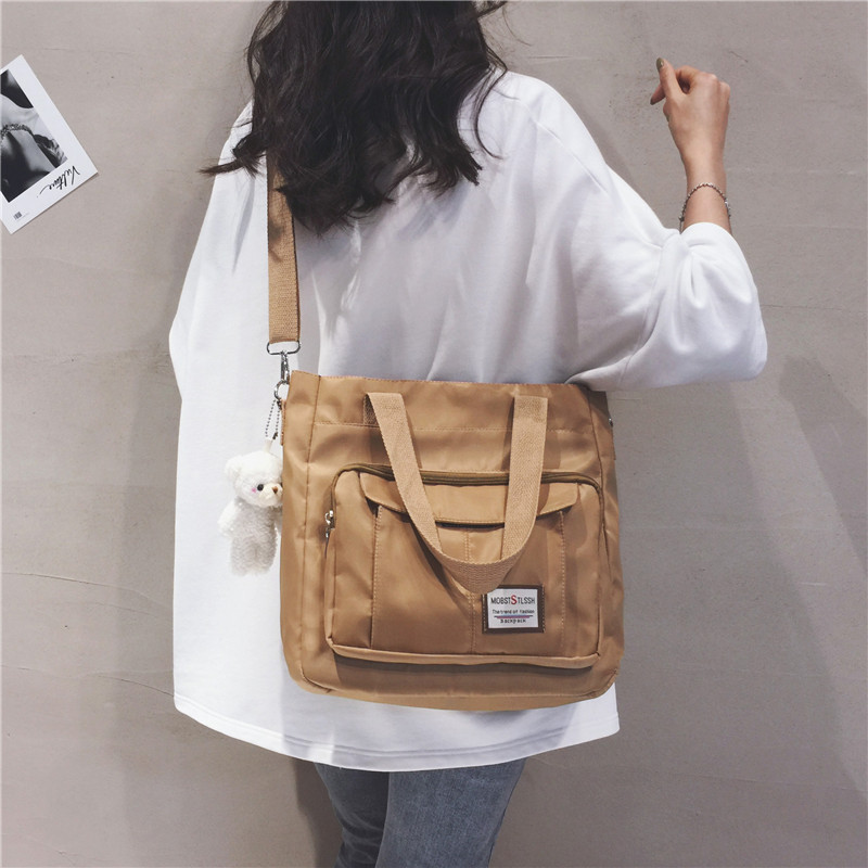 Large-capacity canvas bag for women, 2022 new trendy student lightweight hand-held class bag, casual tote bag, single-shoulder bag details Picture