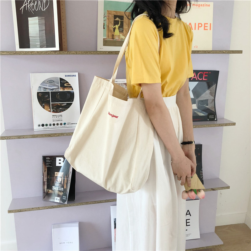 The new C34 ins single-shoulder bag, embroidered canvas bag, Bonjour capacity shopping cloth bag, hand-carry, simple and fashionable details Picture