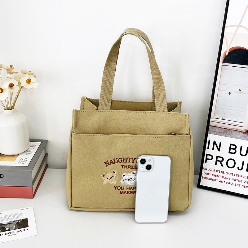 New wholesale fashionable and high-quality canvas handbag, simple and portable, easy to carry for going out, versatile lunch box and bento bag Application Scenario