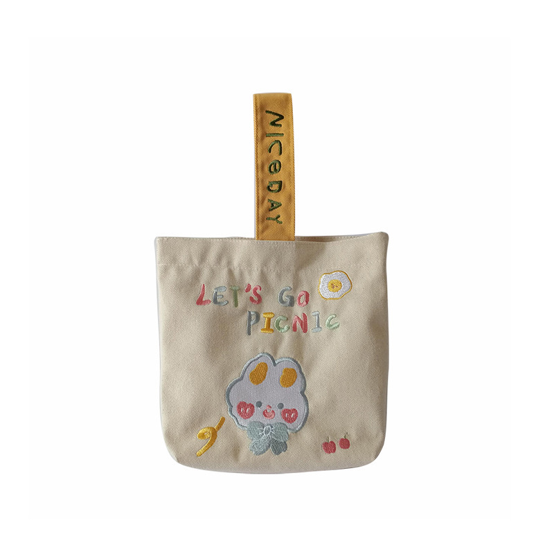 19241 Cute cartoon embroidered hand-held canvas bag, hand-held bucket bag, student commuting sundries bento bag wholesale Item Picture
