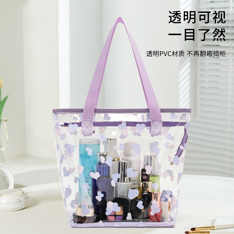 Factory direct sales transparent printed cosmetic bags, portable large-capacity waterproof pvc storage bags, ladies' hand-held toiletries bags Item Picture