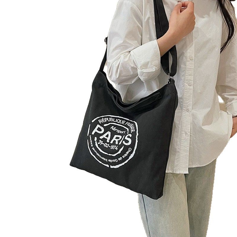 Cross-border students' hand-held canvas bag for class, fashionable lettered trendy tote bag, large-capacity commuting single-shoulder bag for women Item Picture