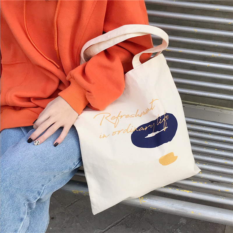 E131 canvas bag, Korean-style ins hand-held shoulder bag, color block letter graffiti shopping bag, female student's search for sources Specification drawing