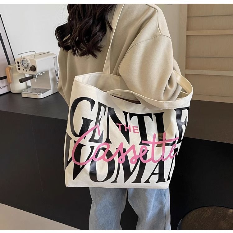 Large-capacity letter-shaped tote bag for women, 2025 new niche single-shoulder canvas bag, versatile ins commuting and tutorial bag Application Scenario