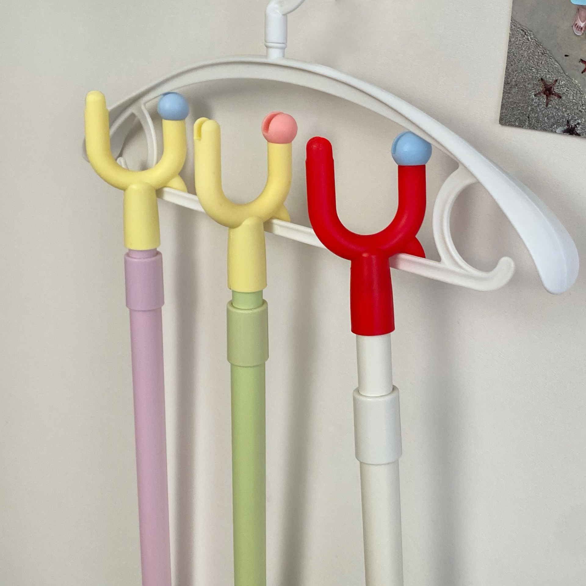 Creative dopamine clothes drying pole, household retractable support pole, dormitory balcony clothes drying and long clothes fork hanging pole Application Scenario