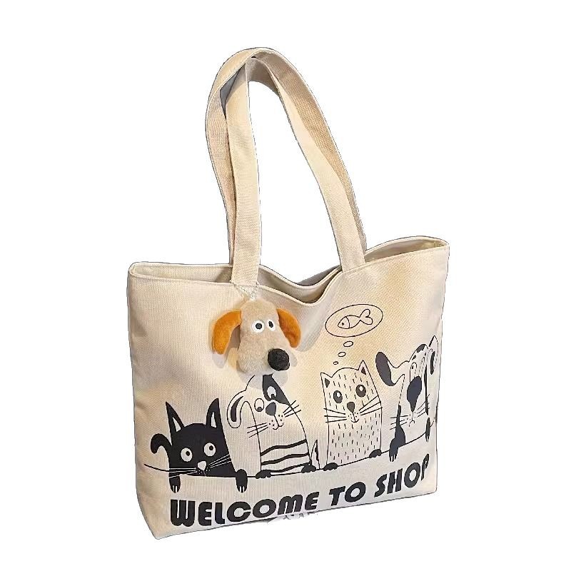 New canvas bag for women 2025, large capacity student shoulder bag, versatile cartoon tote handbag, tote commuter bag Item Picture