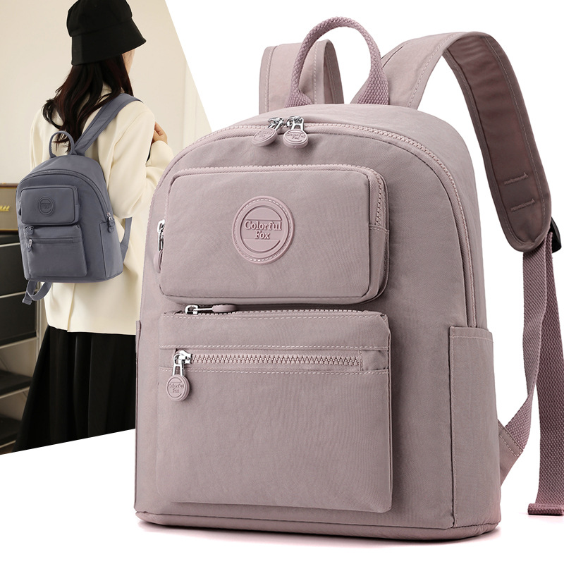 Colorful Fox's new cross-border backpack for women is a fashionable, simple and versatile casual bag made of nylon fabric with a large capacity full figure