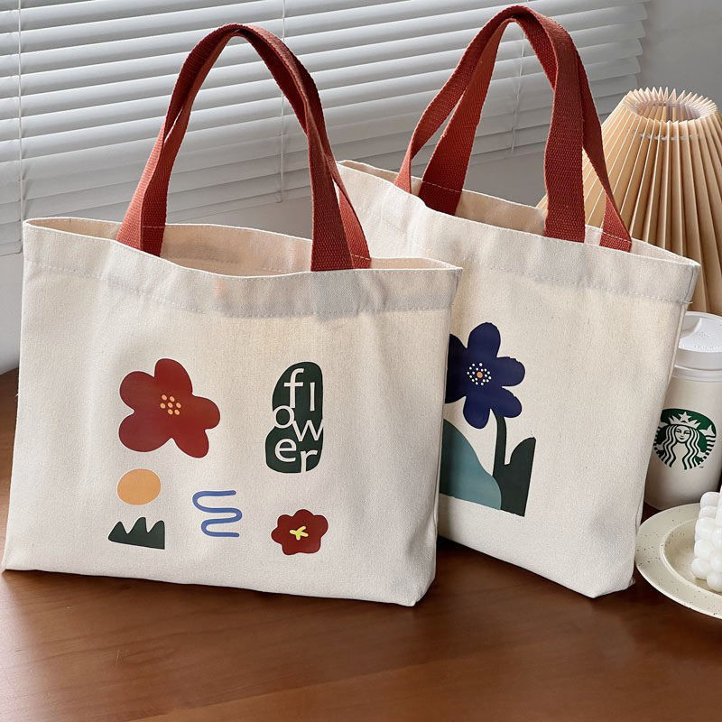 A new hand-drawn illustration flower single-shoulder hand-carry schoolbag for women, a simple and elegant retro portable student canvas bag full figure