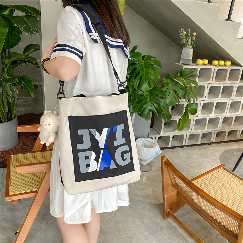 2022 New canvas crossbody bag for women, simple and elegant, large-capacity school bag for students, versatile Japanese-style single-shoulder handbag full figure