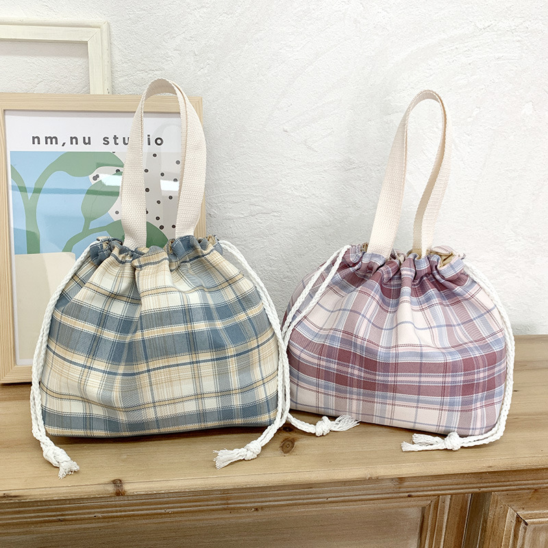 JK Japanese-style small bucket tote canvas bag, new simple and versatile, artistic single-shoulder hand-carry lunch box bag for women Application Scenario