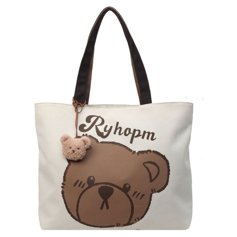 A new large-capacity casual bag for women, a cartoon bear canvas bag, and a single-shoulder tote bag for college students' commuting to class Item Picture