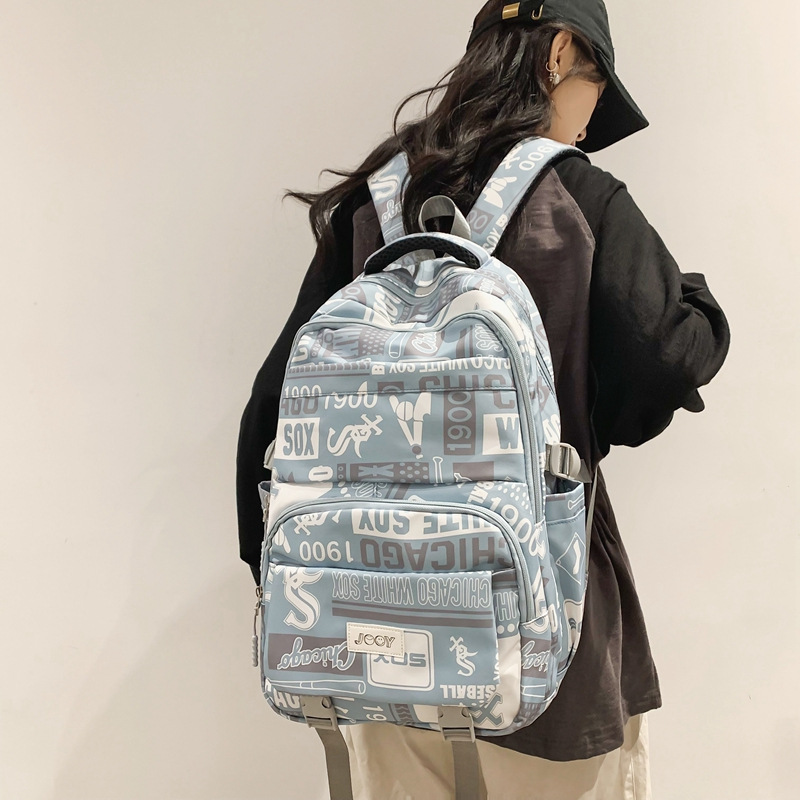 Large-capacity junior high school student schoolbag, travel backpack, niche printed new style, high school and college students go on trips full figure