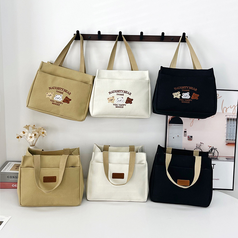 New wholesale fashionable and high-quality canvas handbag, simple and portable, easy to carry for going out, versatile lunch box and bento bag full figure