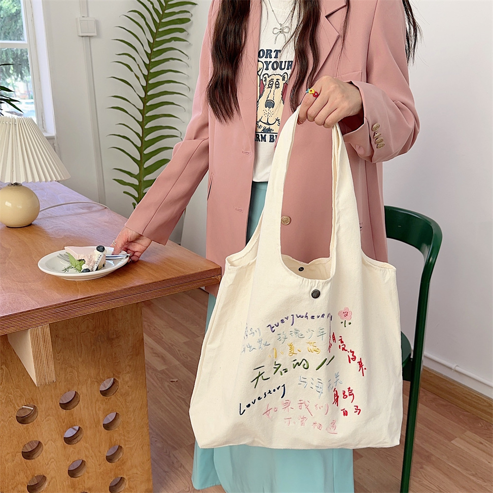 44302 Canvas single-shoulder bag for girls, large-capacity simple embroidered vest bag, hand-held schoolbag for students, canvas bag details Picture