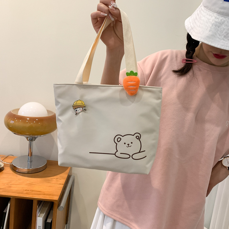 Japanese-style canvas bag, small handbag, casual and fashionable handbag, shoulder bag, light and convenient for going out, women's bag, small student shoulder bag Application Scenario