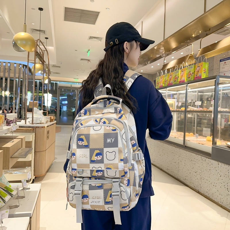 A cute Korean cartoon printed backpack for girls, large-capacity backpack for junior high school, senior high school and university, commuting and going out for primary school students full figure